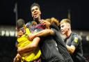 Town players celebrate with Wes Burns after he had scored to give them a 1-0 lead.