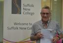 Danny Davey from Ipswich with his English GCSE grade, 59 years after leaving school