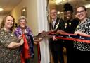 Felixstowe mayor David Rowe, centre, cuts the ribbon to launch the new cinema at Cotman House care home in Felixstowe