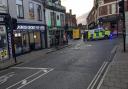 A woman was taken to hospital after falling in Ipswich town centre