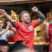 Crowds celebrate England's goal against Italy in the first half