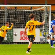 Ipswich keeper Vaclav Hladky is beaten as Cambridge United score.