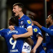 Cameron Humphries celebrates Freddie Ladapo scoring the third goal for Ipswich at Port Vale.