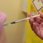 Eligible patients are being urged to book their Covid flu injections as soon as possible.