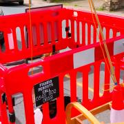 Residents have made light of a deep sinkhole on their street