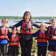On Thursday a delegate from Chelmondiston Church of England Primary School made their way across the River Orwell to collect the Paralympic torch. Image: Charlotte Bond