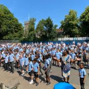 Pupils and staff at a school in Ipswich performed a flash mob for their headteacher Darren Gates, who is leaving after 22 years