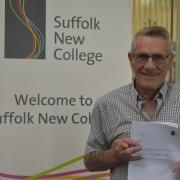 Danny Davey from Ipswich with his English GCSE grade, 59 years after leaving school