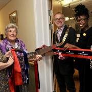 Felixstowe mayor David Rowe, centre, cuts the ribbon to launch the new cinema at Cotman House care home in Felixstowe