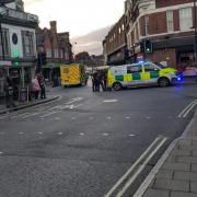 A woman was taken to hospital after falling in Ipswich town centre