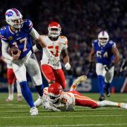 Buffalo Bills quarterback Josh Allen slips past Kansas City Chiefs cornerback Nazeeh Johnson to score on a 26-yard run (Julia Demaree Nikhinson/AP)