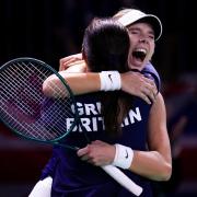 Katie Boulter, right, celebrates victory over Canada’s Leylah Fernandez with captain Anne Keothavong (Manu Fernandez/AP)