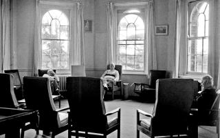 Oscar Joachim's photograph of patients sitting in the day room at St Clement’s.