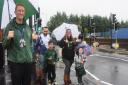 From left, Laureate Community Academy headteacher David Perkins, Apo Fidan and his son Zinar, five, and Alicia Otley and her son, Daxton Orchard, also five