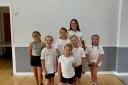 Team - The dancers who are going to LA are Tilly Sestak (7), Emmie Davis (8), Lottie Davis (10), Isabelle Clarke (10), Ava Lecount (11) and Beau Rowland (8), pictured with their teacher Rebecca