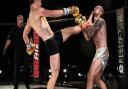 Dean Pattinson lands a teep to the chin of Charlie O'Neill in their main event at Contenders 30 Picture: BRETT KING