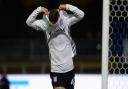 Bersant Celina celebrates his second goal with his trademark shirt removal at Adams Park against Wycombe.