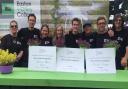 Easton and Otley College  horticultural students and staff in the garden they created with their certificates Picture: JOHN NICE