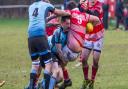 Woodbridge's Tom Stokes makes a big hit against Thetford. Picture: SIMON BALLARD