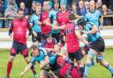 Woodbridge captain Tom Stokes is tackled in the draw with Wisbech. Picture: PAUL LEECH