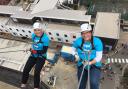 Claire Moore (left) and Hayley Reed abseil down Ipswich Hospital