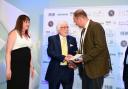 Trevor Hunnaball has won a lifetime achievement award after spending 65 years in the funeral industry