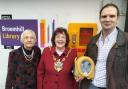 Inga Lockington, Lynne Mortimer and Dr Dan Poulter with the defibrillator at Broomhill library.