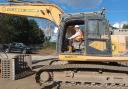 Neil MacDonald on a digger at Hawke Road, Ipswich