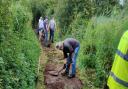 The Greenways project team gets to work improving the footpath in Bourne Park following last winter's floods