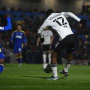 Tyreeq Bakinson shoots at AFC Wimbledon during the first half.