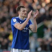 A disappointed George Edmundson applauds the travelling supporters at Home Park.