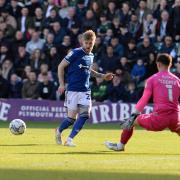 Hayden Coulson sets up an early chance at Home Park.