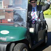 The Stewards gather the judging boxes together for day one of the Suffolk Show 2011.; Mike Harris speeds off with the boxes.