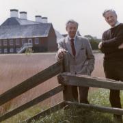 Benjamin Britten and Peter Pears standing in front of the recently completed Snape Maltings Concert Hall - 1969 Picture: ARCHANT ARCHIVE