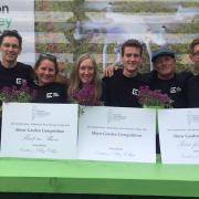 Easton and Otley College  horticultural students and staff in the garden they created with their certificates Picture: JOHN NICE