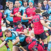 Woodbridge captain Tom Stokes is tackled in the draw with Wisbech. Picture: PAUL LEECH