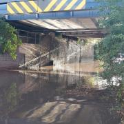 The lorry has been recovered but the road is still flooded