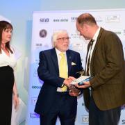 Trevor Hunnaball has won a lifetime achievement award after spending 65 years in the funeral industry