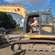 Neil MacDonald on a digger at Hawke Road, Ipswich