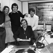 The line-up on Radio Orwell when the station came on the air October 28,1975, included (from the left standing) Harry Rowell, Katie Glass, Greg Bance and Keith Rogers. Seated at the console is Andy Archer.