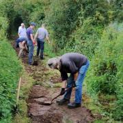 The Greenways project team gets to work improving the footpath in Bourne Park following last winter's floods