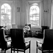 Oscar Joachim's photograph of patients sitting in the day room at St Clement’s.