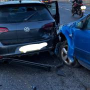 A woman was injured after a three-vehicle crash at a key Ipswich junction. 