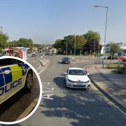 A man was taken to hospital after a crash between a police car and a motorcycle at an Ipswich junction. 