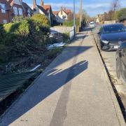 The car destroyed the picket fence of a property in Church Road before continuing into the front garden