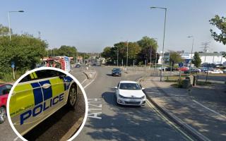 A man was taken to hospital after a crash between a police car and a motorcycle at an Ipswich junction. 